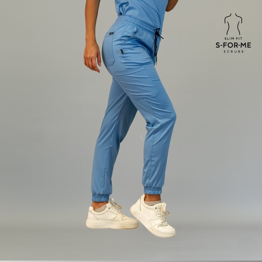 Side view of women’s ceil blue jogger scrub pants with elastic waist and cargo pocket