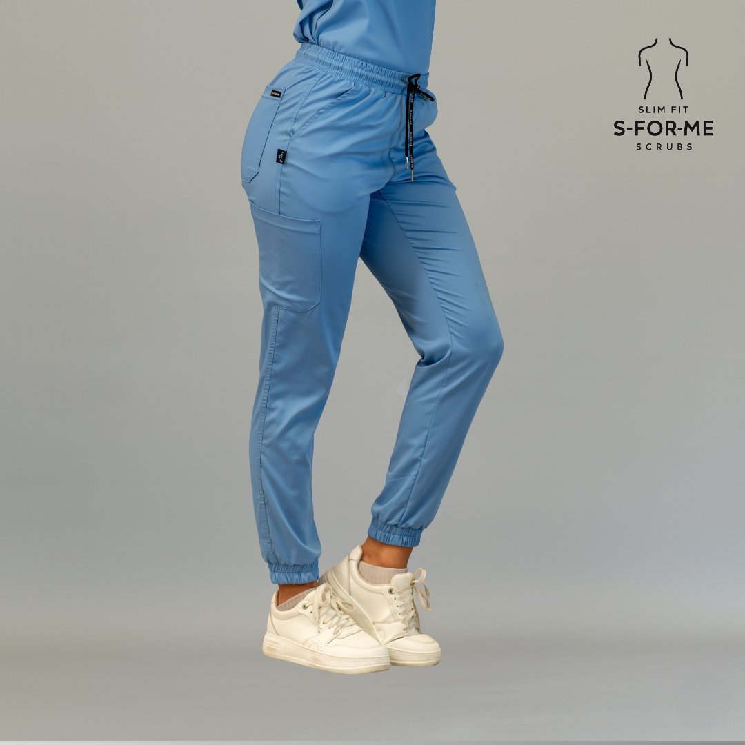 Women’s ceil blue jogger scrub pants front side view with elastic waist and cargo pocket
