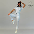 Women’s white scrub uniform set in active lifestyle pose