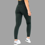 Back view of women's scrub joggers 920 super stretch bottle green with model turning slightly.