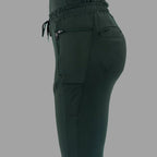 Close-up back side view of women's scrub joggers 920 super stretch bottle green highlighting back pockets.