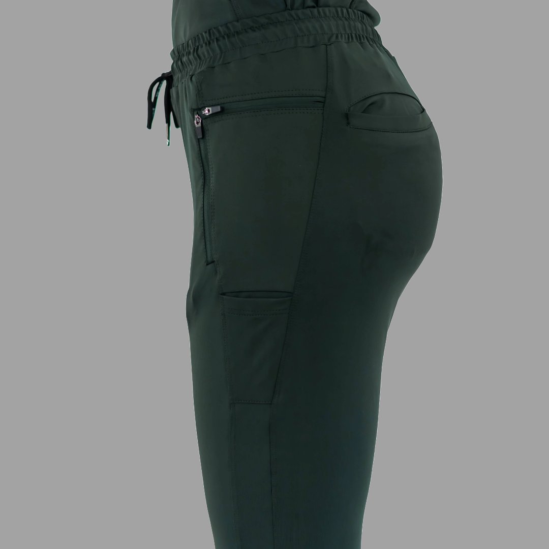 Close-up back side view of women's scrub joggers 920 super stretch bottle green highlighting back pockets.
