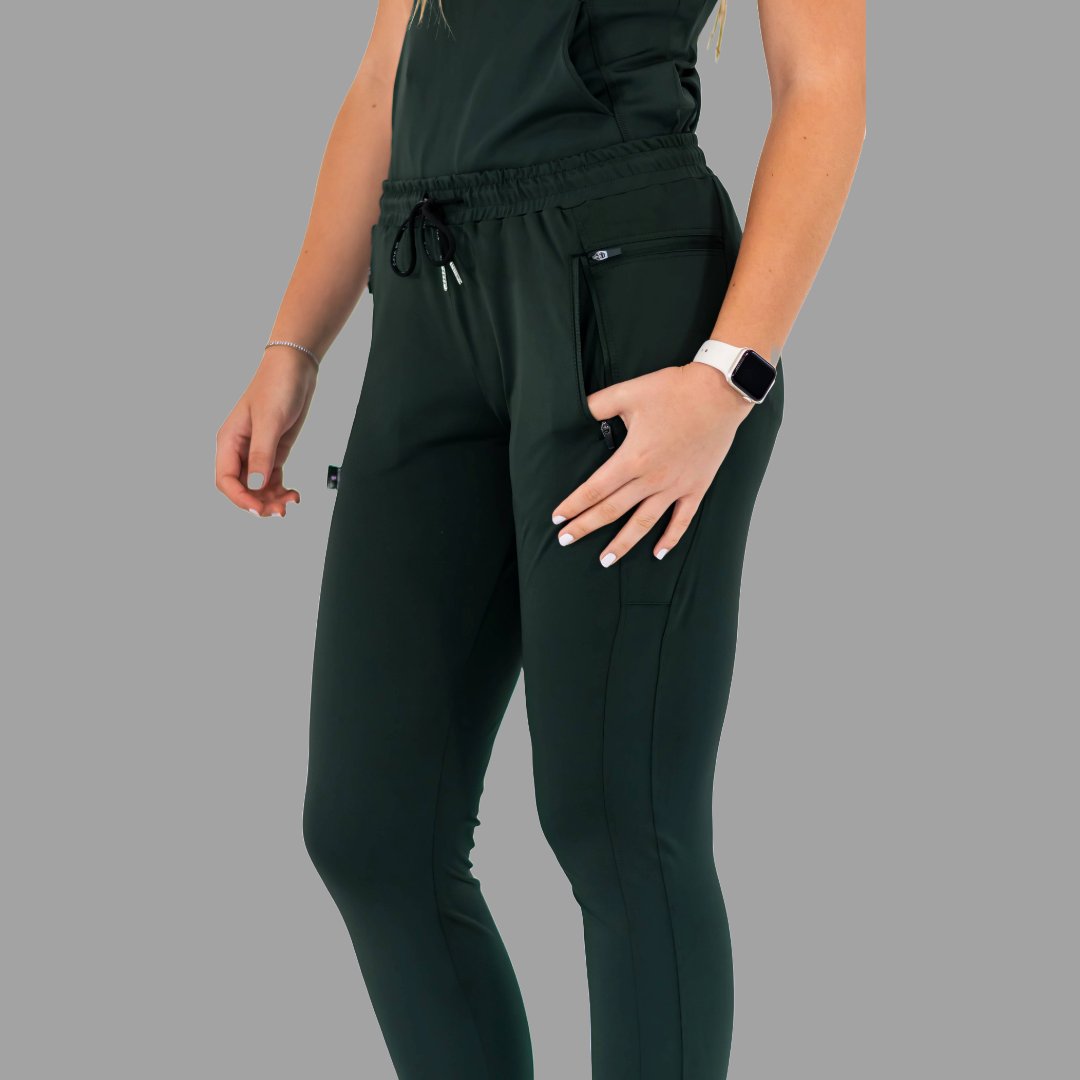 Close-up front view of women's scrub joggers 920 super stretch bottle green highlighting the drawstring.