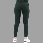 Straight back view of women's scrub joggers 920 super stretch bottle green highlighting the fit.