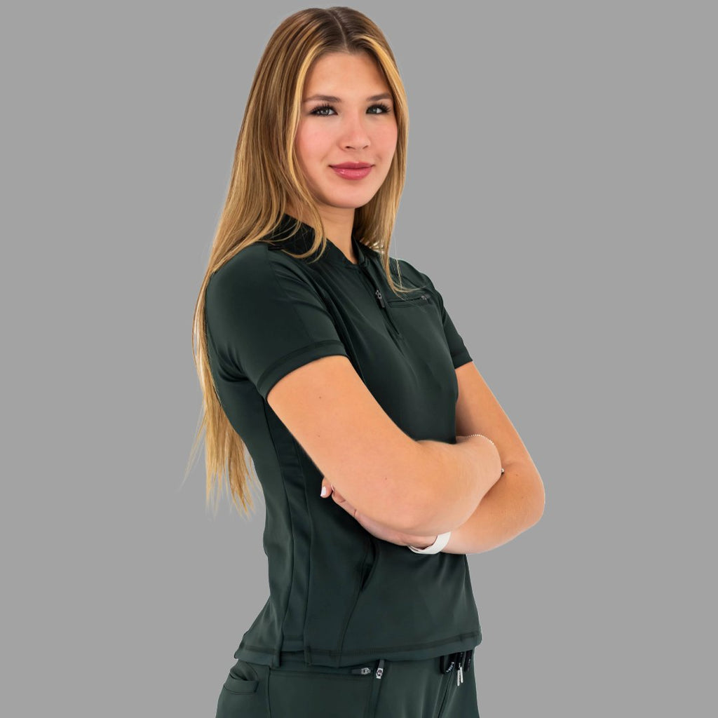 Side profile of a woman with crossed arms in a bottle green 920 super stretch scrub top.