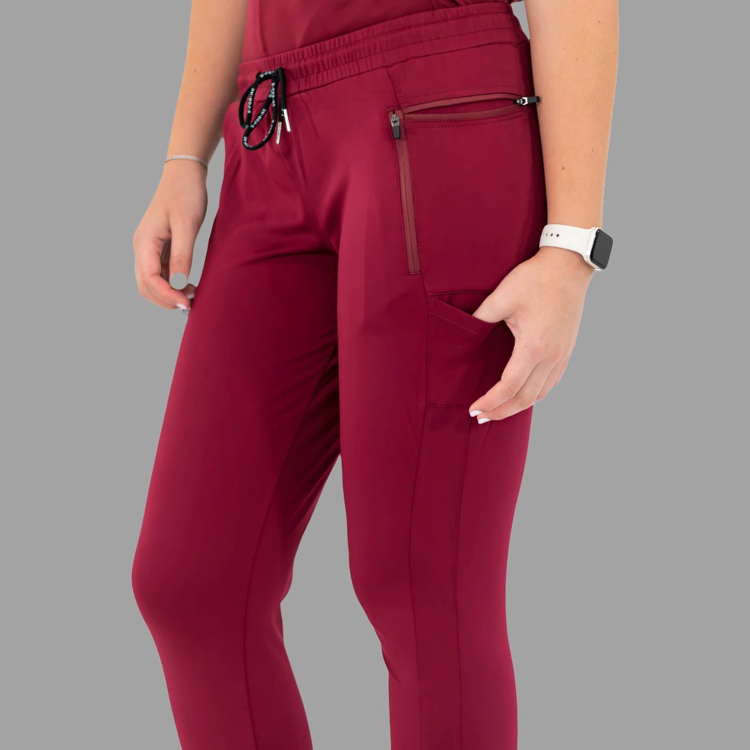Close-up front view of burgundy women's joggers 920, showing the drawstring and waist details.
