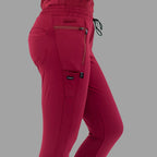 Close-up side view of burgundy women's joggers 920, showing the side cargo pocket.