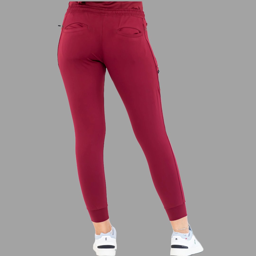 Back view of burgundy women's joggers 920, standing straight.