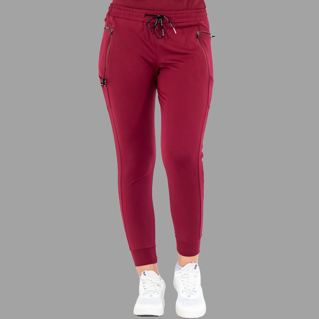 Front view of burgundy women's joggers 920, standing with feet together.