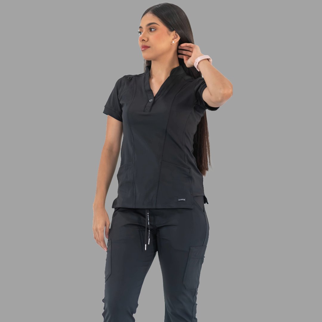 Women's black Style 930 scrub top, front view with hand in hair